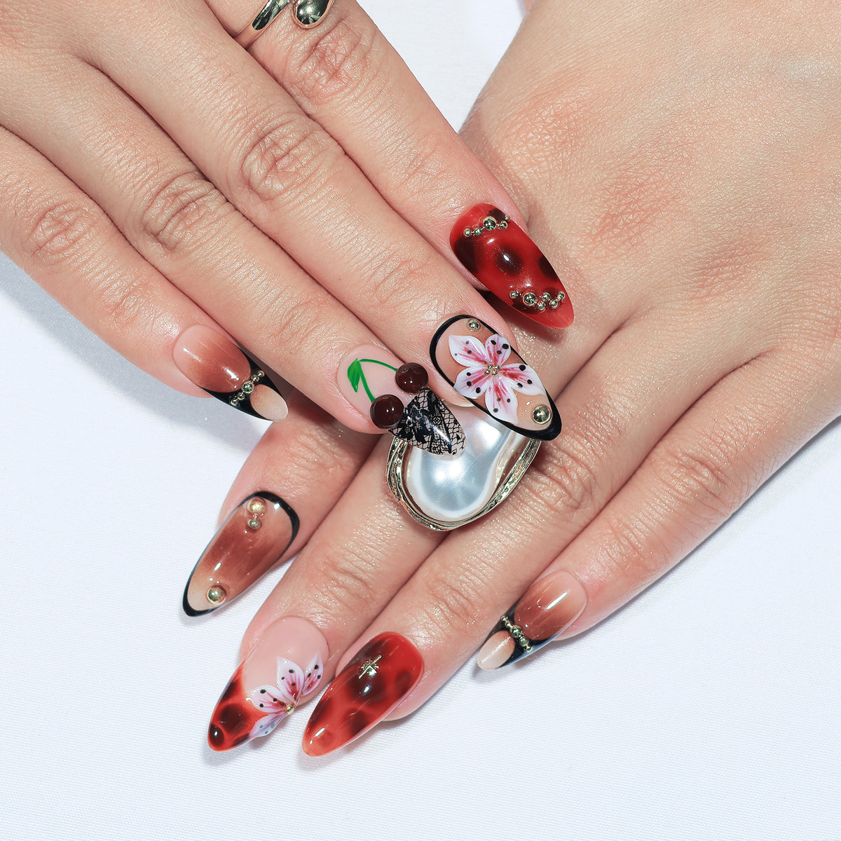 Cherry Latte medium almond press-on nails, tortoiseshell with cherry accents – Briluxe (view 3)
