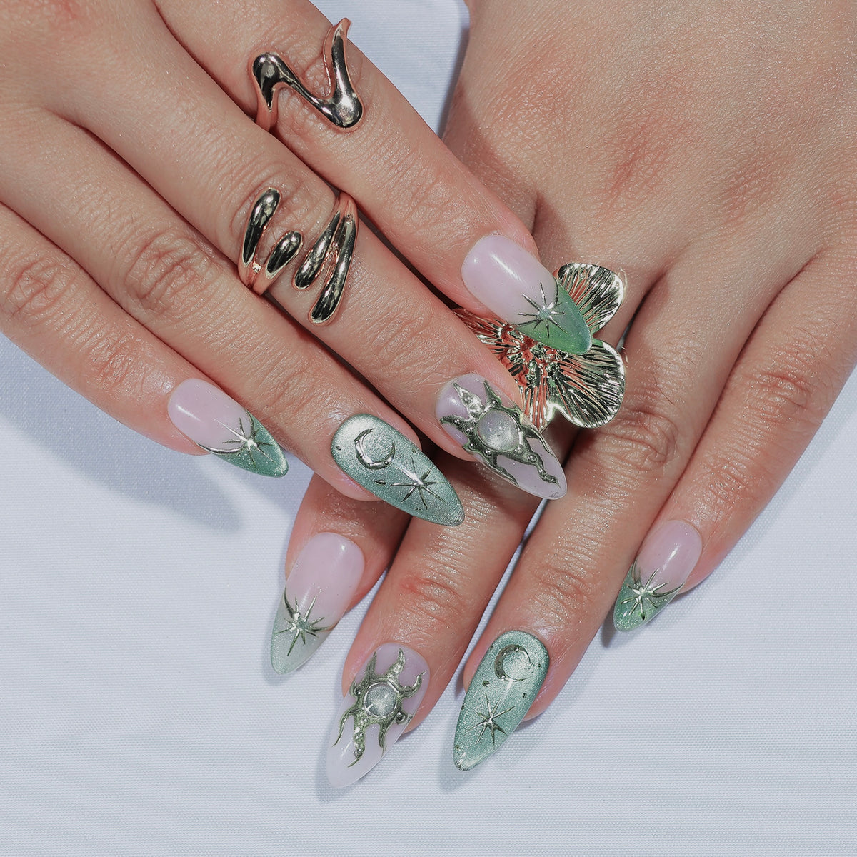 Lunar Sage medium almond press-on nails, sage green with moon and star details – Briluxe (view 2)