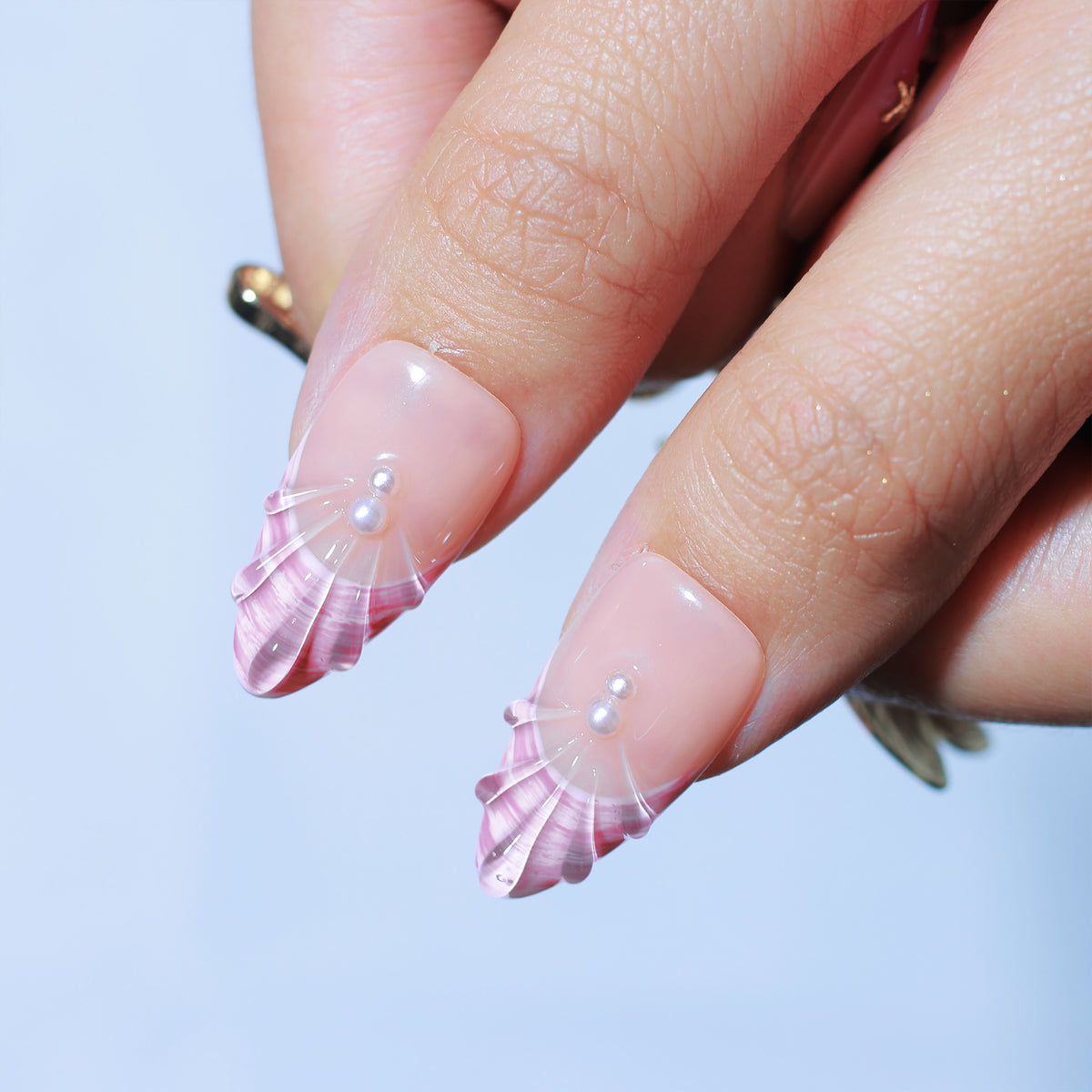 Malibu Seashell medium almond press-on nails, pink shell texture with pearls – Briluxe (view 5)