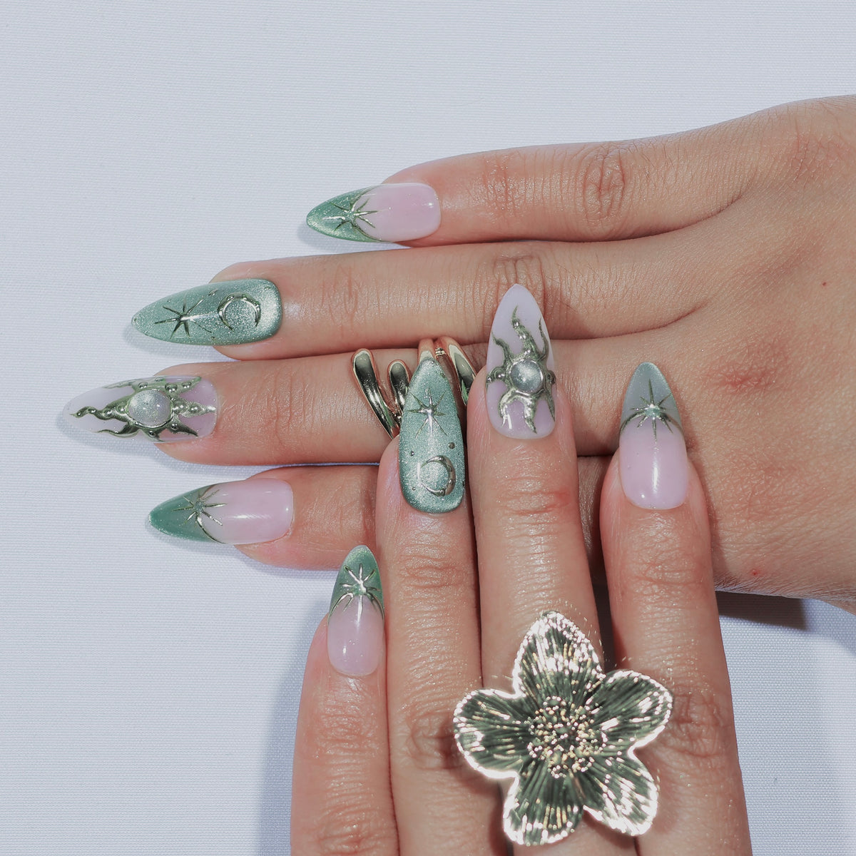 Lunar Sage medium almond press-on nails, sage green with moon and star details – Briluxe (view 3)