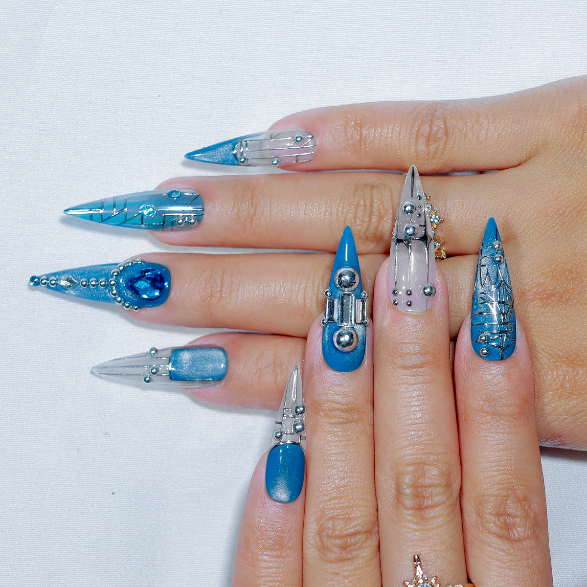 Cyber Siren long stiletto press-on nails, blue-silver chrome with 3D gem – Briluxe (view 3)