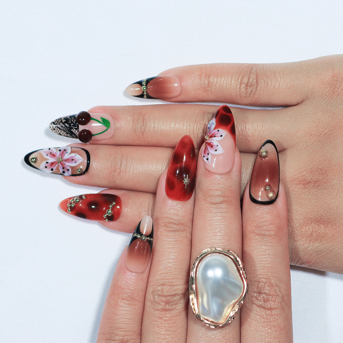 Cherry Latte medium almond press-on nails, tortoiseshell with cherry accents – Briluxe (view 2)