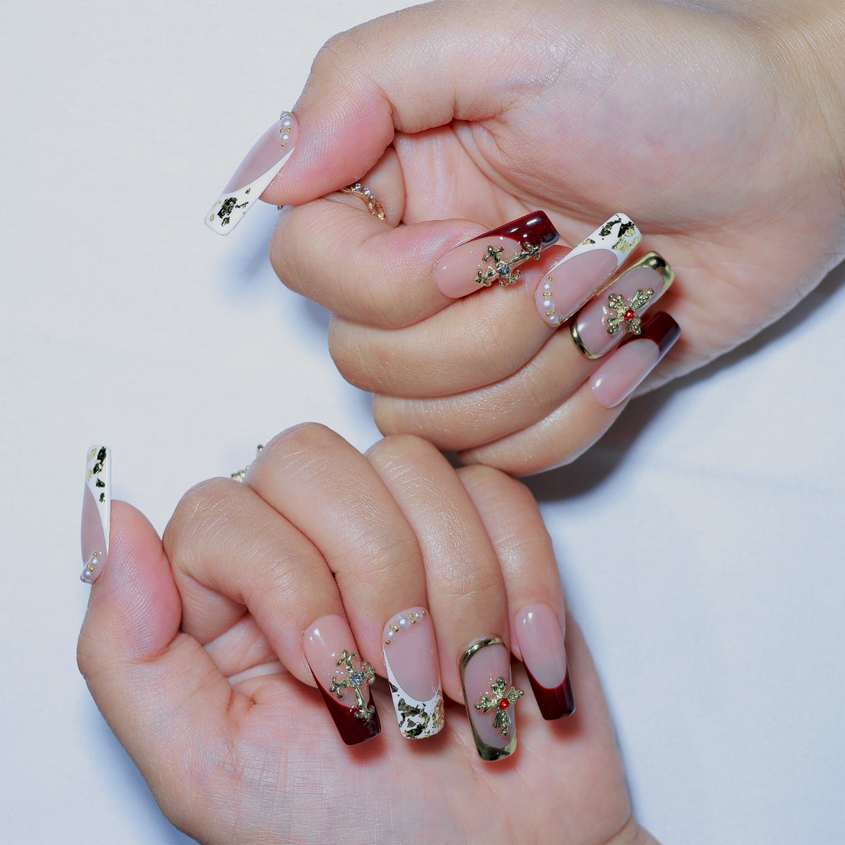 Saint Rouge medium square press-on nails, burgundy French tips with gold crosses – Briluxe (view 4)