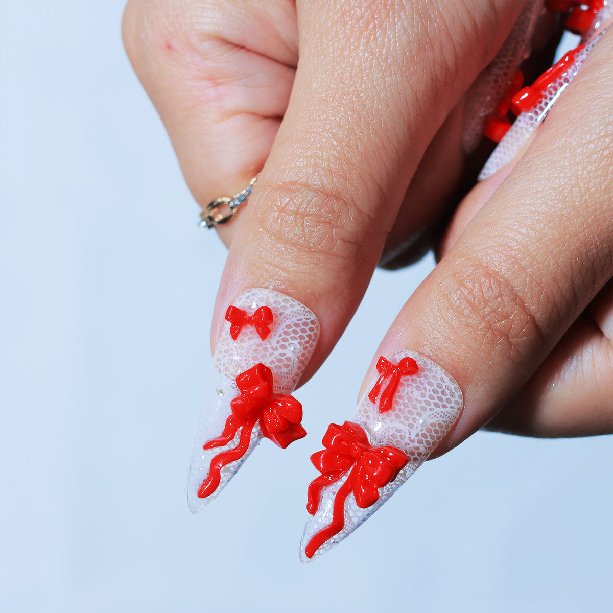 Ribbon Trouble long stiletto press-on nails, lace with red 3D bows – Briluxe (view 5)